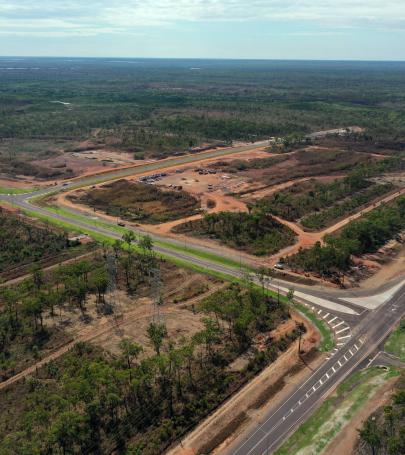 Alt text: Aerial view of Middle Arm Precinct showing road network, site access and early-stage development works 